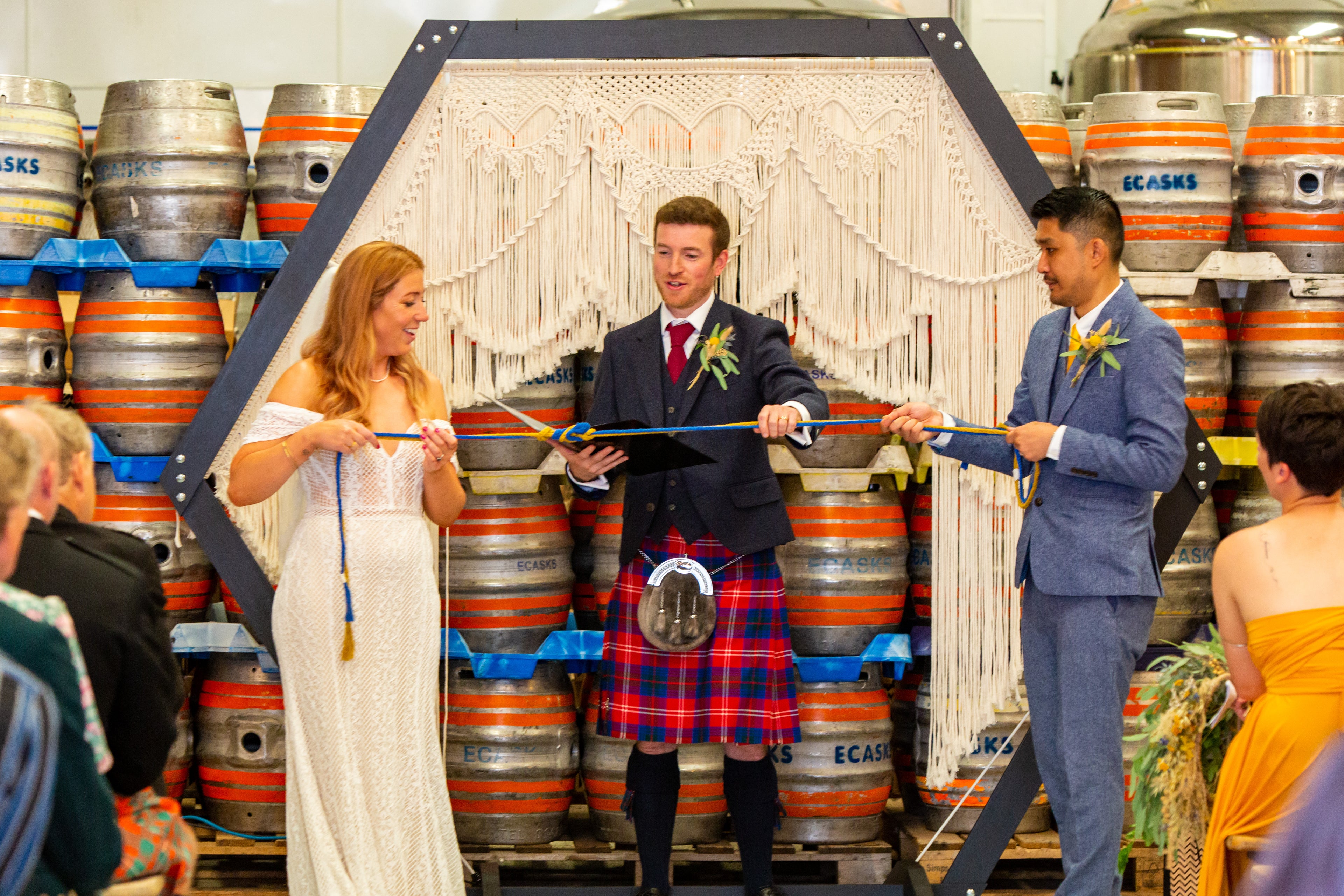 macrame hexagonal wedding backdrop with handfasting cords