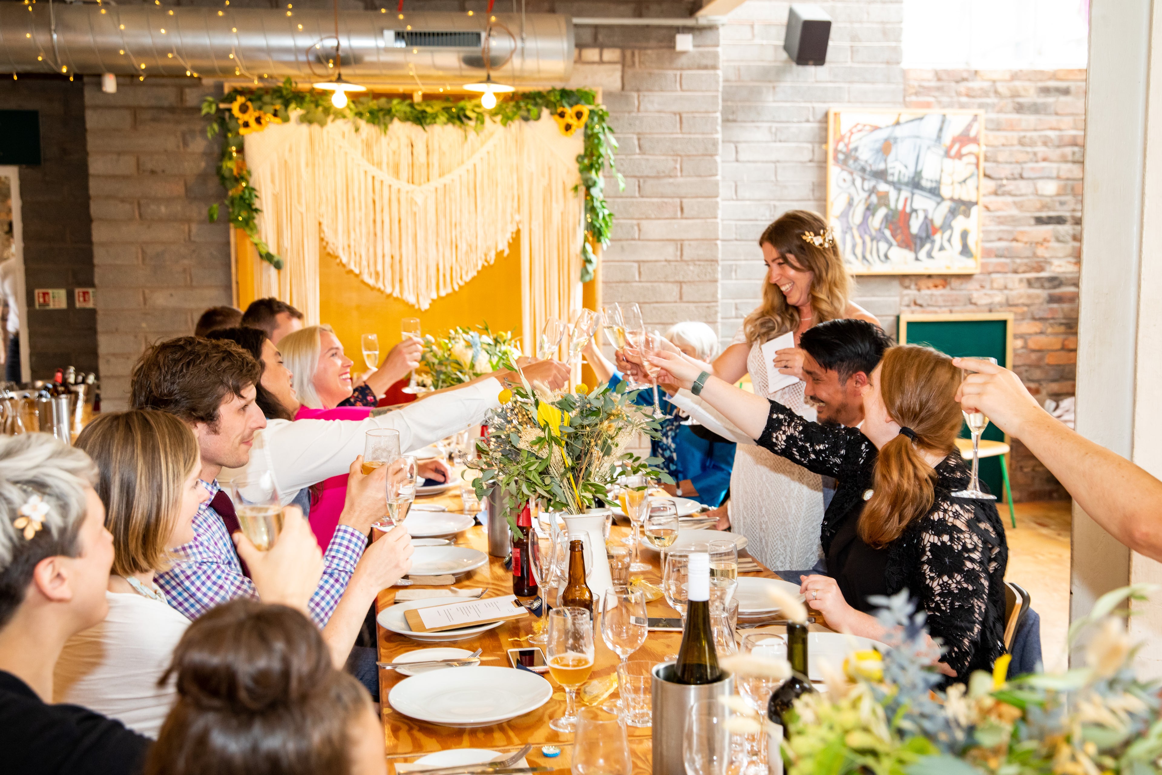 macrame wedding backdrop at wedding reception